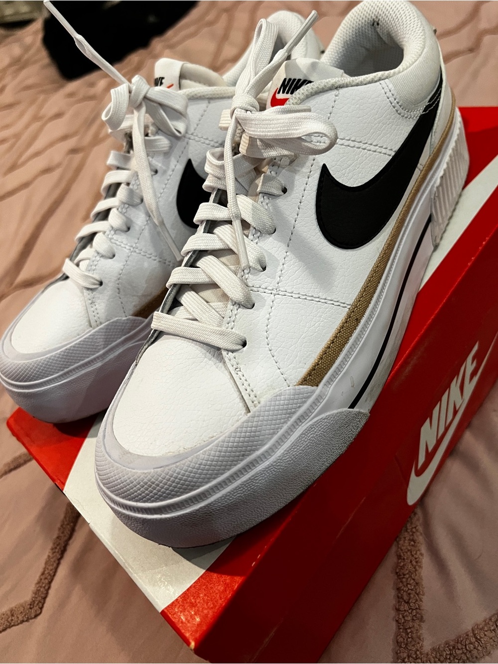 Nike White Low-Top Sneakers with Black Swoosh and Tan Accent